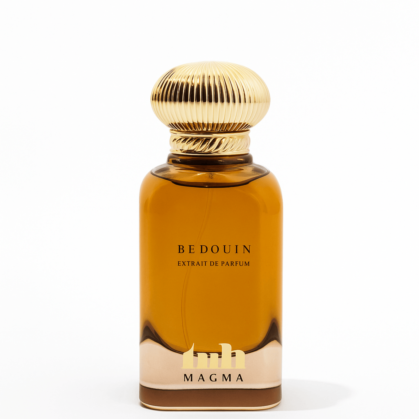 Magma Bedouin Extrait de Parfum in a luxurious amber glass bottle with a sculpted gold cap, displayed on a clean white background. The design evokes desert opulence and Bedouin heritage, blending modern elegance with traditional Arabian inspiration.