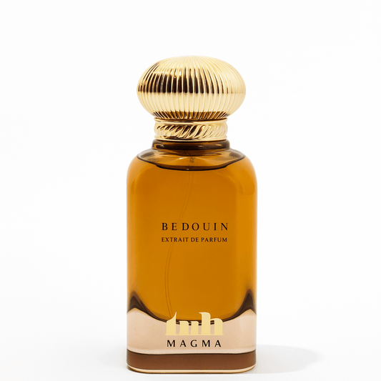 Magma Bedouin Extrait de Parfum in a luxurious amber glass bottle with a sculpted gold cap, displayed on a clean white background. The design evokes desert opulence and Bedouin heritage, blending modern elegance with traditional Arabian inspiration.